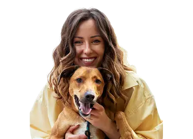 Woman smiling with her emotional support dog